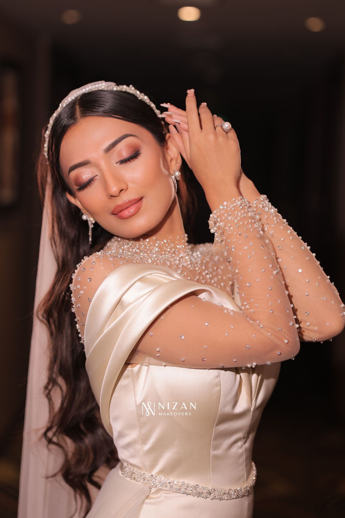 Bride with styled hair and drape